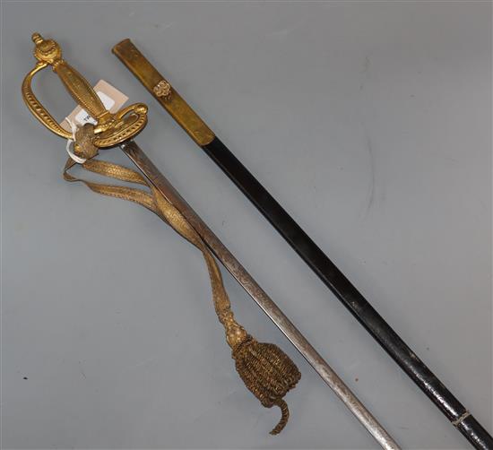 A Court sword having gilt metal hilt and etched blade, with frog, leather scabbard and outer case